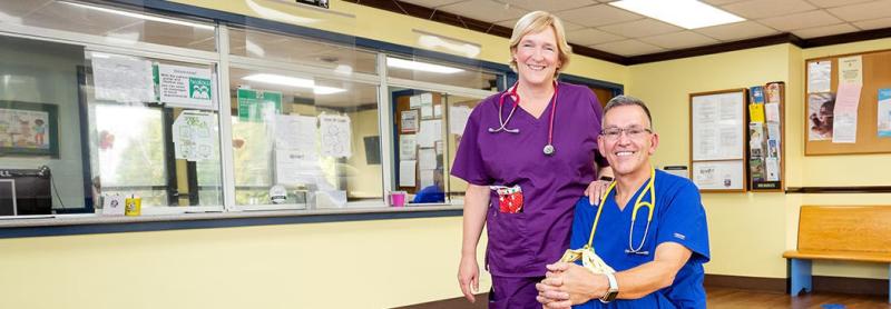 a male and female medical providers in the lobby of their office